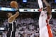 Apr 19, 2014; Toronto, Ontario, CAN; Brooklyn Nets forward Paul Pierce (34) hits a three-pointer against Toronto Raptors forward Patrick Patterson (54) in game one during the first round of the 2014 NBA Playoffs at Air Canada Centre. The Nets beat the Raptors 94-87. Mandatory Credit: Tom Szczerbowski-USA TODAY Sports