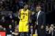 Cleveland Cavaliers head coach Mike Brown talks to Luol Deng (9) in an NBA basketball game against the Charlotte Bobcats Saturday, April 5, 2014, in Cleveland. (AP Photo/Mark Duncan)