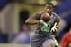 Washington State defensive back Deone Bucannon runs a drill at the NFL football scouting combine in Indianapolis, Tuesday, Feb. 25, 2014. (AP Photo/Michael Conroy)