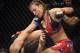 Apr 19, 2014; Orlando, FL, USA; (Editors note: Caption correction) Miesha Tate (red gloves) fights Liz Carmouche (blue gloves) in their women's bantamweight fight during UFC on FOX 11 at Amway Center. Mandatory Credit: David Manning-USA TODAY Sports