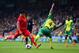 NORWICH, ENGLAND - APRIL 20: Luis Suarez of Liverpool is challenged by Bradley Johnson of Norwich City during the Barclays Premier League match between Norwich City and Liverpool at Carrow Road on April 20, 2014 in Norwich, England. (Photo by Jamie McDonald/Getty Images)
