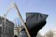 Jim McLarty is dressed as the grim reaper as he walks near the New Jersey Statehouse, Tuesday, March 31, 2009, in Trenton, N.J., before a rally to protest Gov. Jon S. Corzine's budget-cutting proposals, including eliminating some property tax rebates and enacting worker wage freezes and furloughs. He also wants to eliminate an income tax deduction. (AP Photo/Mel Evans)
