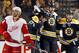 Detroit Red Wings' Drew Miller skates away as Boston Bruins' Jarome Iginla, right, Milan Lucic (17) and Zdeno Chara celebrate after Chara scored during the third period of Boston's 4-1 win in Game 2 of a first-round NHL hockey playoff series in Boston Sunday, April 20, 2014. (AP Photo/Winslow Townson)