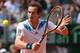 NAPLES, ITALY - APRIL 06: Andy Murray of Great Britain plays a backhand volley during his straight sets defeat in the fourth rubber by Fabio Fognini of Italy during day three of the Davis Cup World Group Quarter Final match between Italy and Great Britain at Tennis Club Napoli on April 6, 2014 in Naples, Italy. (Photo by Clive Brunskill/Getty Images)