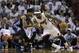 Miami Heat's LeBron James (6) drives to the basket as Charlotte Bobcats' Chris Douglas-Roberts, left, during the second half in Game 1 of an opening-round NBA basketball playoff series, Sunday, April 20, 2014, in Miami. The Heat defeated the Bobcats 99-88. (AP Photo/Lynne Sladky)