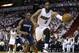 Miami Heat's Dwyane Wade (3) grabs a ball from going out of bounds as Charlotte Bobcats' Bismack Biyombo (0) defends during the first half in Game 1 of an opening-round NBA basketball playoff series, Sunday, April 20, 2014, in Miami. (AP Photo/Lynne Sladky)