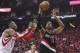 Apr 20, 2014; Houston, TX, USA; Portland Trail Blazers forward LaMarcus Aldridge (12) shoots the ball as Houston Rockets center Dwight Howard (12) defends during the second quarter in game one during the first round of the 2014 NBA Playoffs at Toyota Center. Mandatory Credit: Troy Taormina-USA TODAY Sports