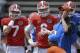 Florida's new Offensive Coordinator Kurt Roper, right, calls out instructions as he works with quarterbacks Will Grier (7) and Jeff Driskel (6) prior to the University of Florida's 2014 Orange & Blue Debut football game Saturday, April 12, 2014 in Gainesville, Fla. (AP Photo/Phil Sandlin)