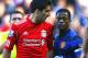 FILE - In this Oct. 15, 2011 file photo, Manchester United's Patrice Evra argues with Liverpool's Luis Suarez, left, during their English Premier League soccer match at Anfield, Liverpool, England. The English Football Association said Tuesday, Dec. 20, 2011, that Liverpool striker Luis Suarez has been banned for eight matches and fined 40,000 pounds ($62,000) after being found guilty of racially abusing Manchester United defender Patrice Evra. (AP Photo/Tim Hales, file)