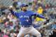 Toronto Blue Jays starting pitcher R.A. Dickey delivers to the Minnesota Twins during the first inning of the first baseball game of a doubleheader in Minneapolis, Thursday, April 17, 2014. (AP Photo/Ann Heisenfelt)