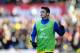 STOKE ON TRENT, ENGLAND - MARCH 01: Mesut Ozil of Arsenal warms up as a substitute during the Barclays Premier League match between Stoke City and Arsenal at Britannia Stadium on March 1, 2014 in Stoke on Trent, England. (Photo by Laurence Griffiths/Getty Images)
