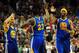 Golden State Warriors guard Stephen Curry (30) and Golden State Warriors center Jermaine O'Neal (7) celebrate after Golden State Warriors forward Draymond Green (23) hit a shot to tie the game at the end of the second half of an NBA basketball game in Portland, Ore., Sunday, April 13, 2014. The Blazers won the game 119-117. (AP Photo/Steve Dykes)