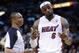 Miami Heat's LeBron James, right, reacts as he talks with official Michael Smith during the second half of an NBA basketball game against the Indiana Pacers, Friday, April 11, 2014, in Miami. The Heat defeated the Pacers 98-86. (AP Photo/Lynne Sladky)