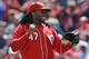 Cincinnati Reds starting pitcher Johnny Cueto reacts after throwing a complete game, three hit shutout, against the Pittsburgh Pirates in a baseball game, Wednesday, April 16, 2014, in Cincinnati. (AP Photo/Al Behrman)