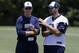 Dallas Cowboys head coach Jason Garrett, left, talks with quarterback Tony Romo as the two watch the team participate in drills during their NFL football minicamp on Tuesday, June 11, 2013, in Irving, Texas. (AP Photo/Tony Gutierrez)