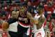 HOUSTON, TX - APRIL 20: LaMarcus Aldridge #12 of the Portland Trail Blazers backs in on Terrence Jones #6 of the Houston Rockets in Game One of the Western Conference Quarterfinals during the 2014 NBA Playoffs at the Toyota Center on April 20, 2014 in Houston, Texas. NOTE TO USER: User expressly acknowledges and agrees that, by downloading and or using this photograph, User is consenting to the terms and conditions of the Getty Images License Agreement. (Photo by Bob Levey/Getty Images)