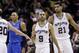San Antonio Spurs' Tony Parker (9), of France, and Tim Duncan (21) after a score against the Dallas Mavericks during the second half of Game 1 of the opening-round NBA basketball playoff series, Sunday, April 20, 2014, in San Antonio. San Antonio won 90-85. (AP Photo/Eric Gay)