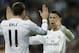 Real's Cristiano Ronaldo, right, celebrates with Real's Gareth Bale after scoring during a Champions League round of 16, second leg, soccer match between Real Madrid and Schalke 04 at the Santiago Bernabeu stadium in Madrid, Tuesday March 18, 2014. (AP Photo/Paul White)