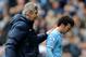 Manchester City manager Manuel Pellegrini, left, pats David Silva on the back after he is substituted during the English Premier League soccer match between Manchester City and Southampton at The Etihad Stadium, Manchester, England, Saturday, April 5, 2014. (AP Photo/Rui Vieira)