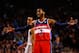 BOSTON, MA - APRIL 16: John Wall #2 of the Washington Wizards talks to his teammates against the Boston Celtics in the second half during the game at TD Garden on April 16, 2014 in Boston, Massachusetts. NOTE TO USER: User expressly acknowledges and agrees that, by downloading and or using this photograph, User is consenting to the terms and conditions of the Getty Images License Agreement. (Photo by Jared Wickerham/Getty Images)