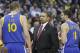 Golden State Warriors coach Mark Jackson, center, talks to forward David Lee (10) and guard Klay Thompson (11) in the first half of an NBA basketball game against the Memphis Grizzlies in Memphis, Tenn., Saturday, Nov. 9, 2013. (AP Photo/Danny Johnston)
