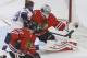 Chicago Blackhawks goalie Corey Crawford (50) makes a glove save on a shot by St. Louis Blues center Steve Ott (29) as Johnny Oduya (27) watches during the first period in Game 3 of a first-round NHL hockey Stanley Cup playoff series game Monday, April 21, 2014, in Chicago. (AP Photo/Charles Rex Arbogast)
