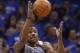 Memphis Grizzlies guard Tony Allen (9) jumps up to grab a pass intended for Oklahoma City Thunder forward Kevin Durant, rear, in the first quarter of Game 2 of an opening-round NBA basketball playoff series in Oklahoma City, Monday, April 21, 2014. (AP Photo/Sue Ogrocki)