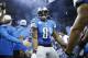 Detroit Lions wide receiver Calvin Johnson (81) is greeted by teammates before the first quarter of an NFL football game against the Baltimore Ravens in Detroit, Monday, Dec. 16, 2013. (AP Photo/Rick Osentoski)