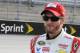 Dale Earnhardt Jr walks down pit road before qualifying for a NASCAR Sprint Cup series auto race at Darlington Speedway in Darlington, S.C., Friday, April 11, 2014. (AP Photo/Mike McCarn)