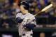 Houston Astros' Matt Dominguez watches his RBI double against the Seattle Mariners Monday, April 21, 2014, during a baseball game in Seattle. (AP Photo/Ted S. Warren)