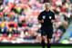 SUNDERLAND, ENGLAND - SEPTEMBER 14: Referee Martin Atkinson in action during the Barclays Premier League match between Sunderland and Arsenal at Stadium of Light on September 14, 2013 in Sunderland, England. (Photo by Laurence Griffiths/Getty Images)