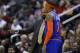 New York Knicks head coach Mike Woodson, left, talks with Carmelo Anthony during the first half of an NBA basketball game against the Washington Wizards, Saturday, Nov. 23, 2013, in Washington. (AP Photo/Nick Wass)