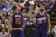 Phoenix Suns forward Marcus Morris, left, congratulates his twin brother, Markieff, after he scored against the Sacramento Kings during the fourth quarter of an NBA basketball game in Sacramento, Calif., Wednesday, April 16, 2014. The Suns won 104-99.(AP Photo/Rich Pedroncelli)