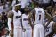 Miami Heat's LeBron James (6), Dwyane Wade (3) and Chris Bosh (1) talk during a timeout in the second half in Game 1 of an opening-round NBA basketball playoff series against the Charlotte Bobcats, Sunday, April 20, 2014, in Miami. The Heat defeated the Bobcats 99-88. (AP Photo/Lynne Sladky)