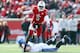 LOUISVILLE, KY - NOVEMBER 23: Teddy Bridgewater #5 of the Louisville Cardinals avoids the tackle of Chase Rome #47 of the Memphis Tigers at Papa John's Cardinal Stadium on November 23, 2013 in Louisville, Kentucky. (Photo by Andy Lyons/Getty Images)