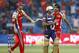 Royal Challengers Bangalore Zaheer Khan, right, celebrates with captain Daniel Vettori, left, the dismissal of Kolkata Knight Riders batsman Manoj Tiwary, center, during their Indian Premier League (IPL) cricket match in Bangalore, India, Tuesday, April 10, 2012. (AP Photo/Aijaz Rahi)