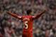 Liverpool's Daniel Sturridge celebrates after scoring against Swansea City during their English Premier League soccer match at Anfield Stadium, Liverpool, England, Sunday Feb. 23, 2014. (AP Photo/Jon Super)
