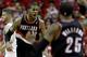 Portland Trail Blazers' LaMarcus Aldridge (12) reacts after making a basket while being fouled during the fourth quarter in Game 1 of an opening-round NBA basketball playoff series against the Houston Rockets Sunday, April 20, 2014, in Houston. The Trail Blazers won 122-120 in overtime. (AP Photo/David J. Phillip)