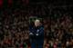 Arsenal's French manager Arsene Wenger stands with his arms folded during the English Premier League soccer match between Arsenal and Swansea City at the Emirates Stadium in London, Tuesday, March 25, 2014. (AP Photo/Matt Dunham)