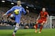Chelsea's Fernando Torres, left, controls the ball watched by Liverpool's Martin Skrtel during the English Premier League soccer match between Chelsea and Liverpool at Stamford Bridge Stadium in London, Sunday, Dec. 29, 2013. (AP Photo/Kirsty Wigglesworth)