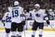 San Jose Sharks right wing Brent Burns, right, celebrates his goal with teammates defenseman Dan Boyle, left, and center Joe Thornton during the first period in Game 3 of an NHL hockey first-round playoff series , Tuesday, April 22, 2014, in Los Angeles. (AP Photo/Mark J. Terrill)