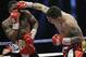 Marcos Rene Maidana, right, lands a punch on Adrien Broner, left, during an WBA welterweight title bout, Saturday, Dec. 14, 2013, in San Antonio. (AP Photo/Eric Gay)