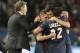 PSG's coach Laurent Blanc, left, congratulates his players after the Champions League quarterfinal first leg soccer match between PSG and Chelsea, at the Parc des Princes stadium, in Paris, Wednesday, April 2, 2014. PSG won the match 3-1. (AP Photo/Christophe Ena)