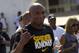 Fighter Anderson Silva, from Brazil, greets fans during the UFC Rio 3 open workouts in Rio de Janeiro, Brazil, Wednesday, Oct. 10, 2012. Silva will face Stephan Bonnar, of the U.S., on Oct. 13 at the Ultimate Fighting Championship (UFC), the organization's third event in Rio de Janeiro. (AP Photo/Silvia Izquierdo)
