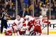 Boston fans cheer while Detroit Red Wings, left to right, Kyle Quincey, Jimmy Howard, Jakub Kindl, and Brian Lashoff slump in the crease after Boston Bruins' Reilly Smith scored during the first period of Boston's 4-1 win in Game 2 of a first-round NHL hockey playoff series in Boston Sunday, April 20, 2014. (AP Photo/Winslow Townson)