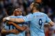 Manchester City's Fernandinho, centre, celebrates with Sergio Aguero, left and Alvaro Negredo after scoring against Sunderland during the English Premier League soccer match between Manchester City and Sunderland at The Etihad Stadium, Manchester, England, Wednesday, April 16, 2014. (AP Photo/Rui Vieira)