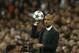 Bayern head coach Pep Guardiola, holds the ball during a first leg semifinal Champions League soccer match between Real Madrid and Bayern Munich at the Santiago Bernabeu stadium in Madrid, Spain, Wednesday, April 23, 2014. (AP Photo/Andres Kudacki)