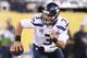 Feb 2, 2014; East Rutherford, NJ, USA; Seattle Seahawks quarterback Russell Wilson (3) scrambles in the fourth quarter against the Denver Broncos at MetLife Stadium. Seattle Seahawks won 43-8. Mandatory Credit: Matthew Emmons-USA TODAY Sports