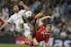 Real's Xabi Alonso, left, and Bayern's Thomas Mueller challenge for the ball during a Champions League semifinal first leg soccer match between Real Madrid and Bayern Munich at the Santiago Bernabeu stadium in Madrid, Spain, Wednesday, April 23, 2014 .(AP Photo/Paul White)