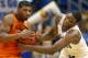 Oklahoma State guard Marcus Smart (33) and Kansas center Joel Embiid (21) battle to a jump ball during the second half of an NCAA college basketball game at Allen Fieldhouse in Lawrence, Kan., Saturday, Jan. 18, 2014. Kansas defeated Oklahoma State 80-78. (AP Photo/Orlin Wagner)